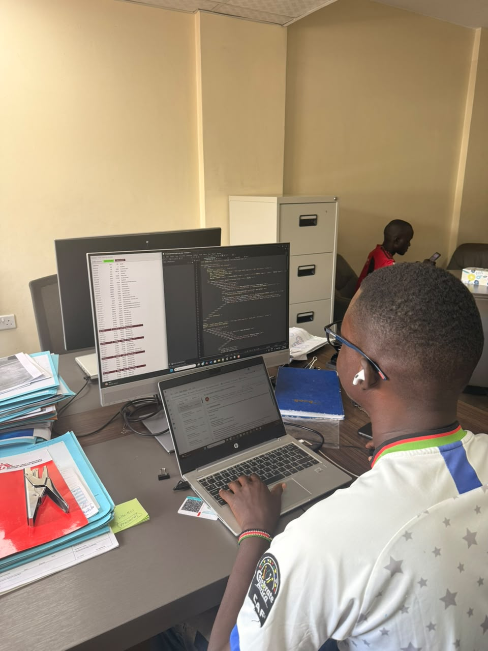 A Codelabs developer working at a dual-monitor coding setup